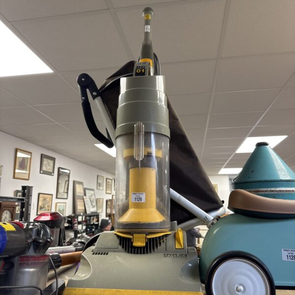 Purple vintage Dyson DC01 upright vacuum cleaner.