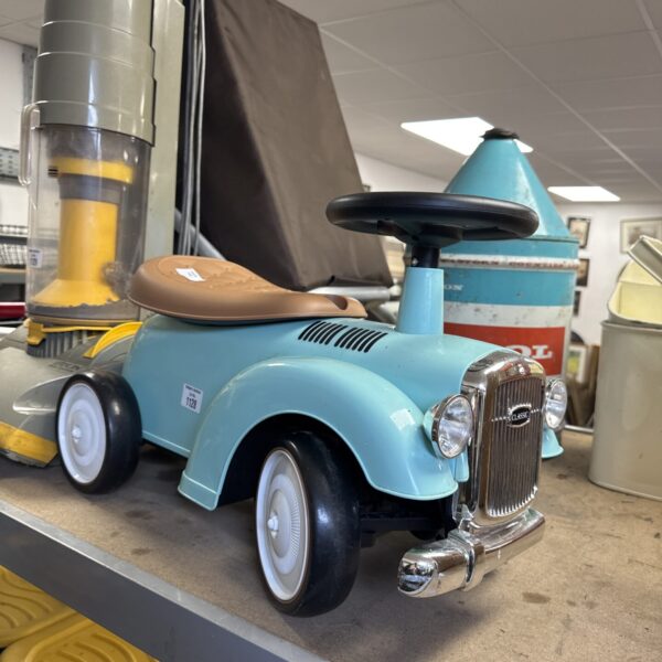 Blue vintage ride on toy car for toddlers.