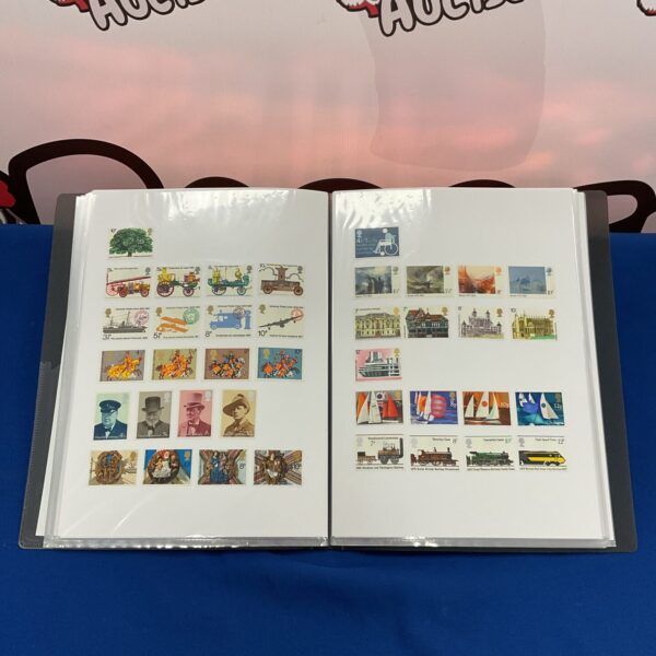 Open page of a British stamp album with colourful vintage stamps.
