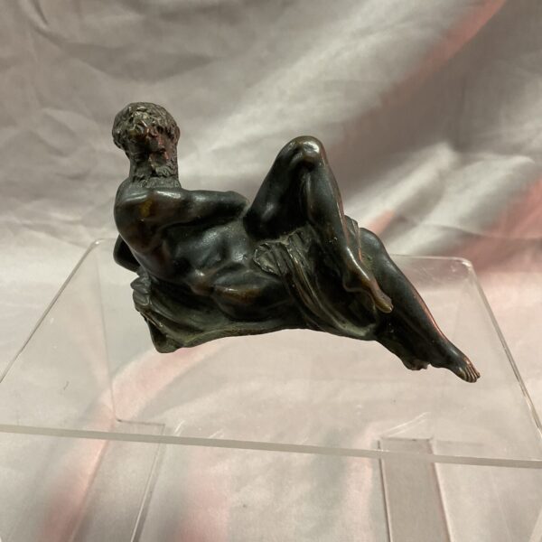 Renaissance bronze sculpture of reclining figure, Medici tomb inspiration.