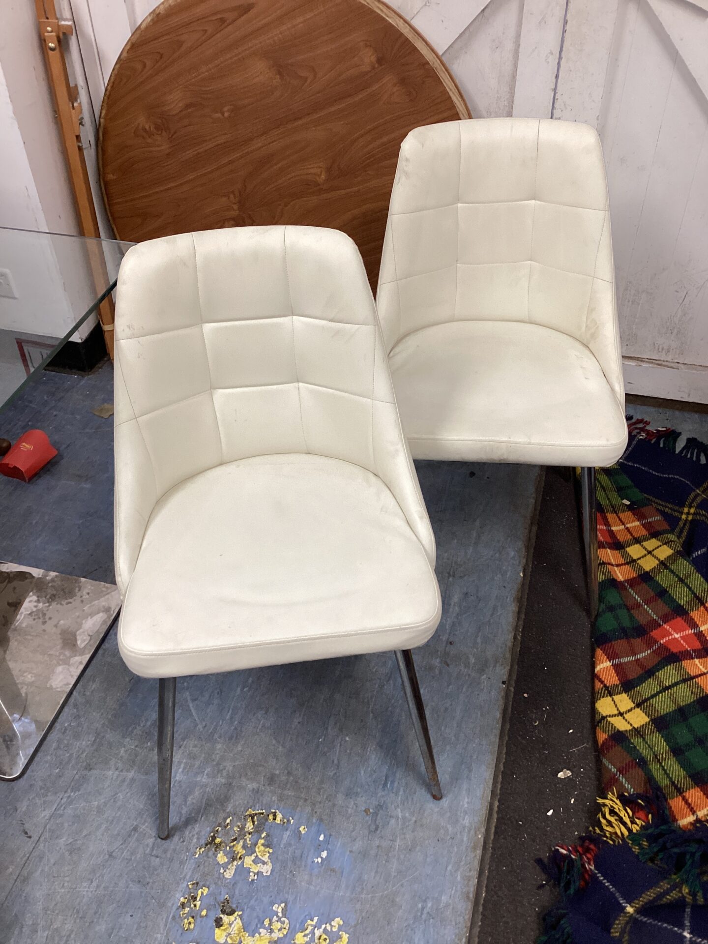 630 Two white leather reception chairs