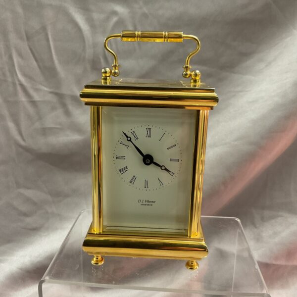 Vintage D J Warner brass carriage clock with Roman numerals.