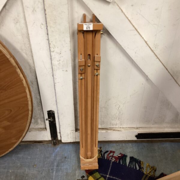 Vintage wooden artist easel for painting and studio use.