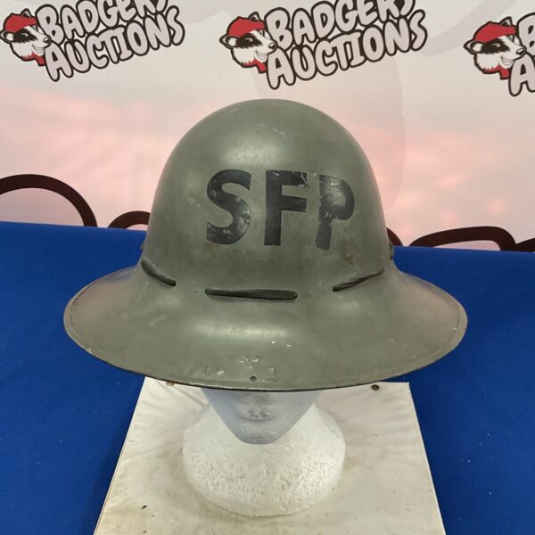 Vintage WWII Zuckerman steel helmet for civil defence, a collectible item.