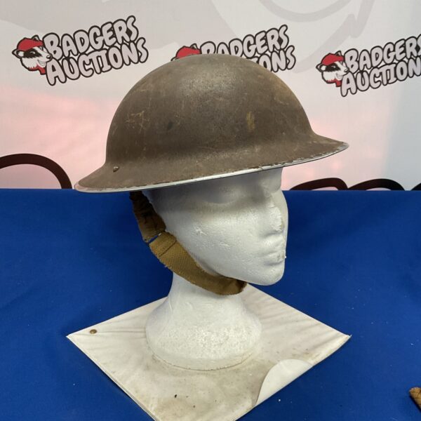 Vintage British steel helmet from 1939, WWII military collectible.