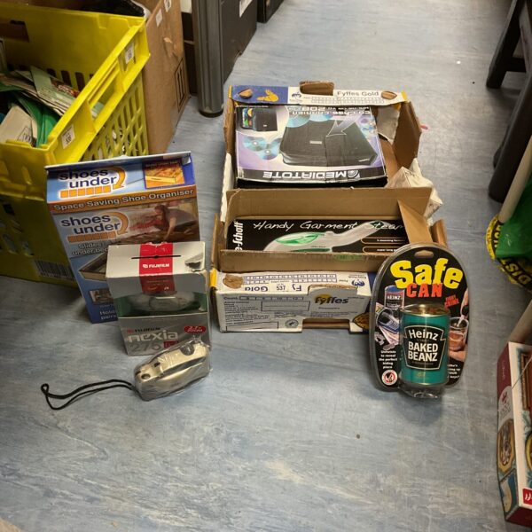 Mixed lot of cameras, household items, and a can of beans.