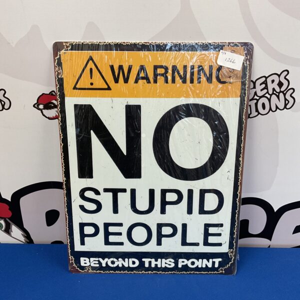 Yellow tin sign warning "No Stupid People Beyond This Point".