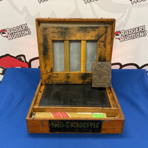 Vintage Neo Cyclostyle duplicator with wooden frame and stencil mechanism.