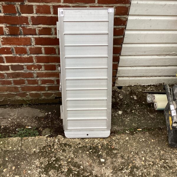 Side view of a portable aluminium access ramp for mobility assistance.