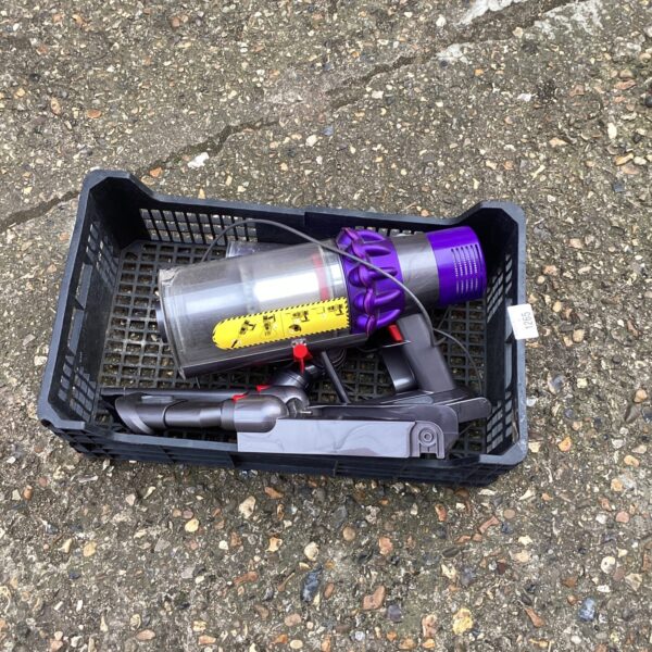 Used Dyson cordless vacuum cleaner with charger.