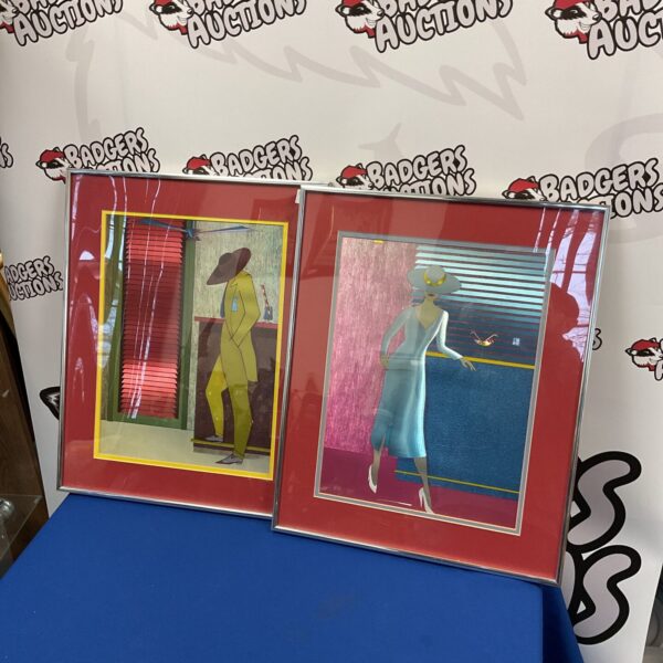 Pair of framed 1950s metallic prints featuring vintage character designs.