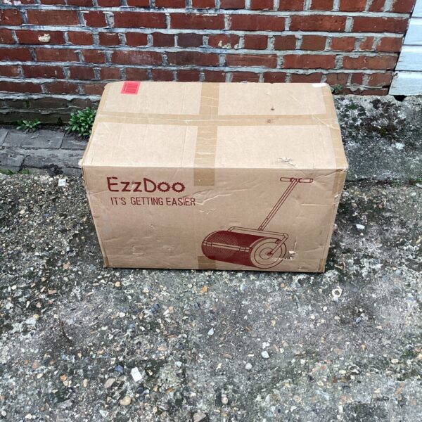 Ezzdoo garden roller in used condition, ideal for landscaping.