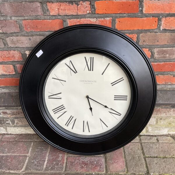 Large vintage Churchgate wall clock with bold black hands.