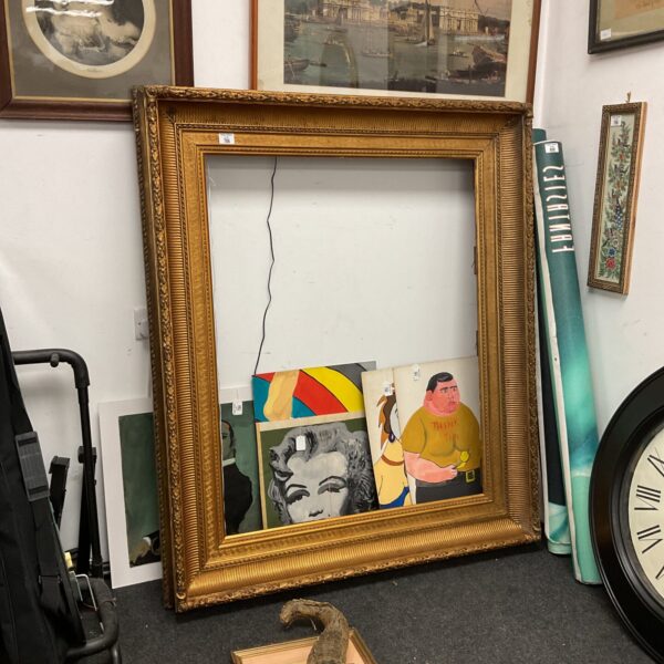 Large gilt picture frame measuring 119cm x 105cm, antique gold finish.
