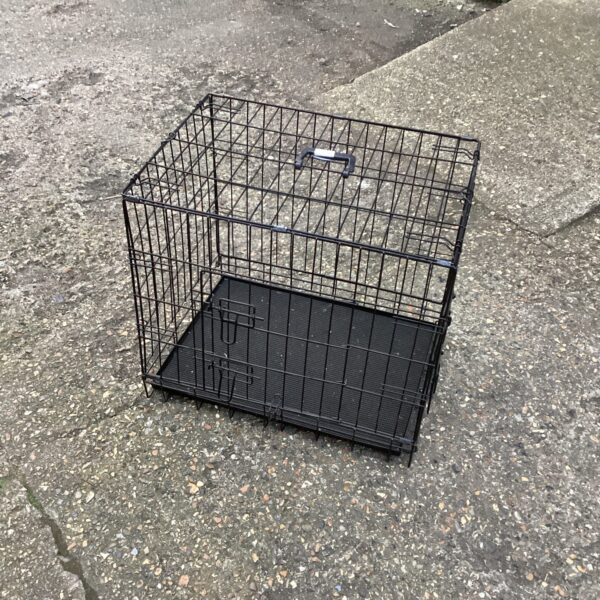 Small wire animal transport cage for pets.