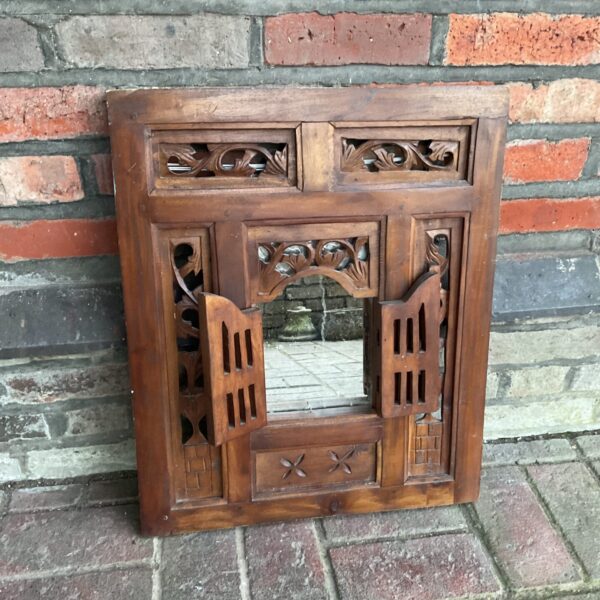 Vintage oak doored mirror with carved details.