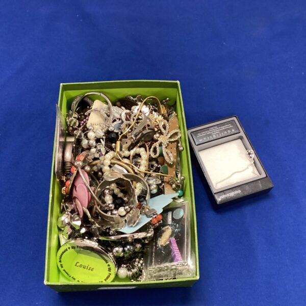 Assorted vintage costume jewellery lot with necklaces and bracelets.