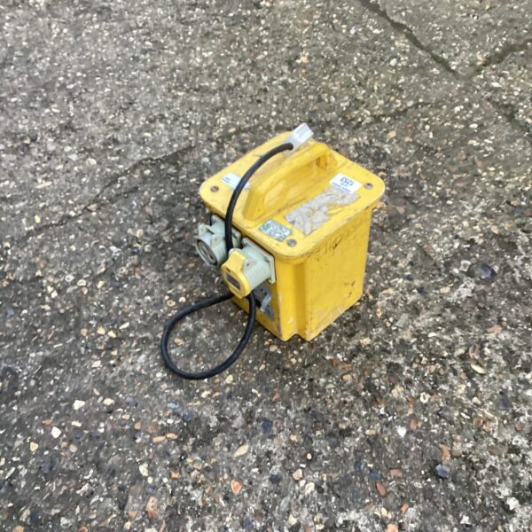 Yellow 110v step-down transformer for voltage conversion.