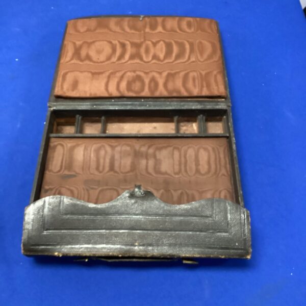 Black leather vintage writing slope with a hinged lid.