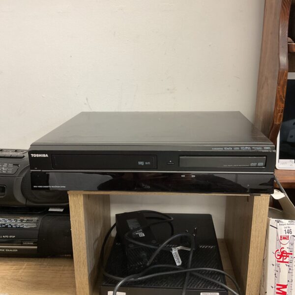 Black Toshiba DVD player, vintage home cinema equipment.