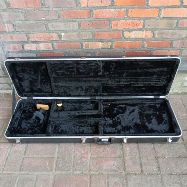 Black Gator guitar case with Hercules wall mount included.