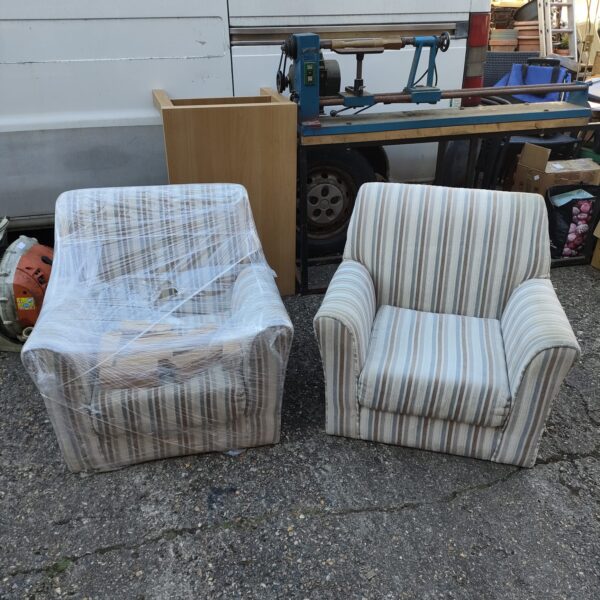 Two striped children’s chairs in a playroom setting.