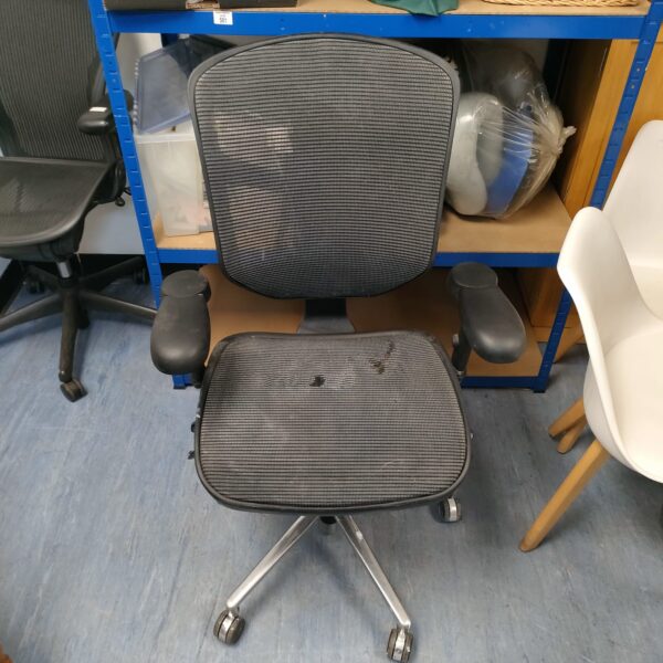 Black ergonomic office chair with mesh back and adjustable height.