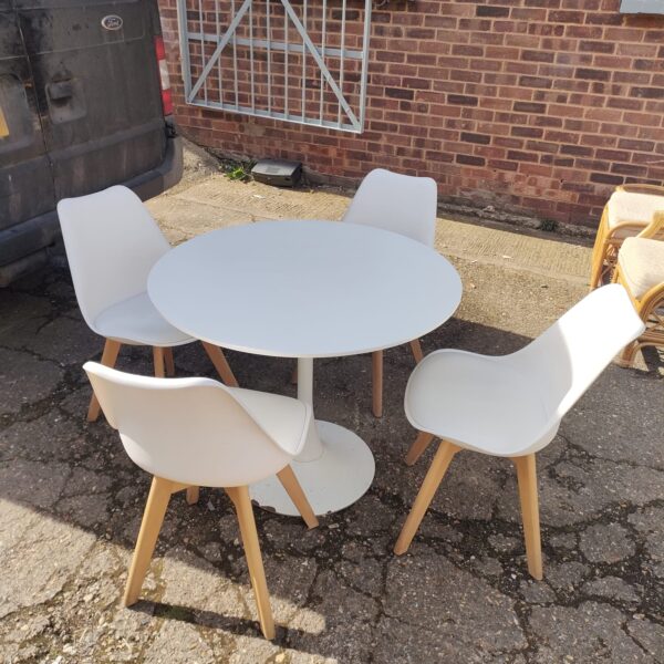 Vintage Ikea dining set with four chairs around a circular table.