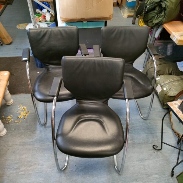 Lot of three black leather and chrome chairs, vintage style.