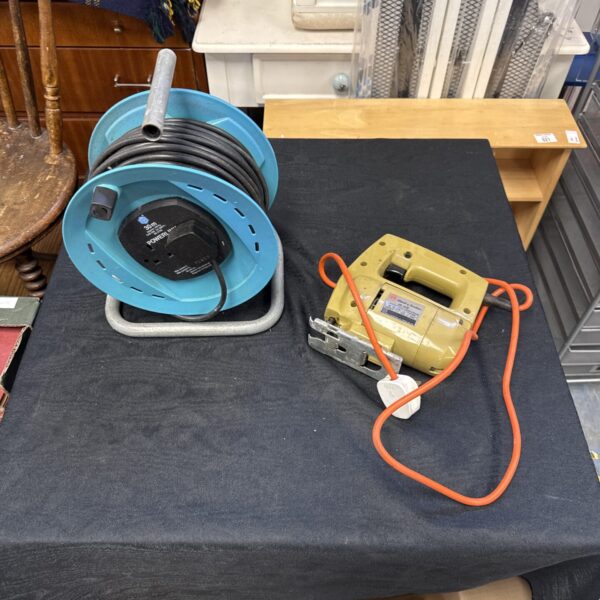 Blue 25m extension reel with cable visible.