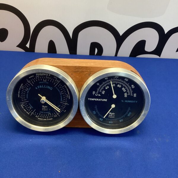 Vintage Taylor instruments desk barometer for weather monitoring.
