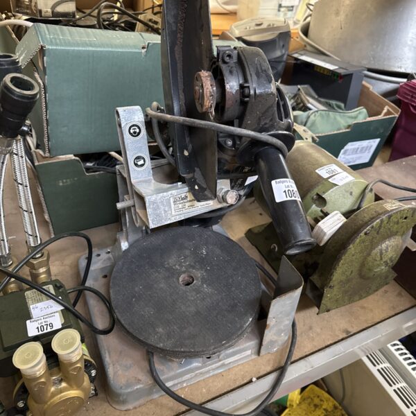Vintage Ferm angle grinder with stand and discs for metalworking.