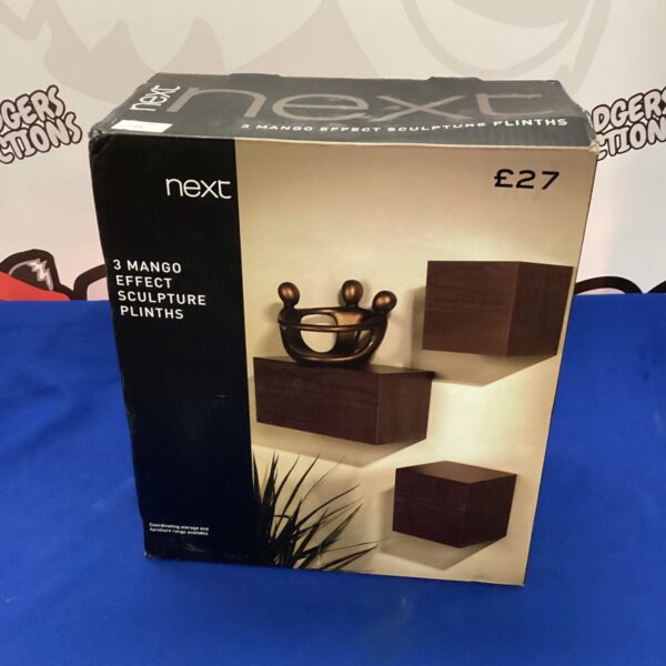 Set of three Next mango effect sculpture plinths for display.