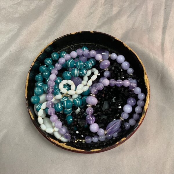 Vintage costume jewellery lot with colourful bead necklaces.