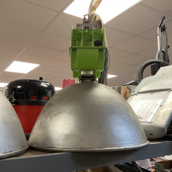 Vintage industrial pendant light with metal shade.