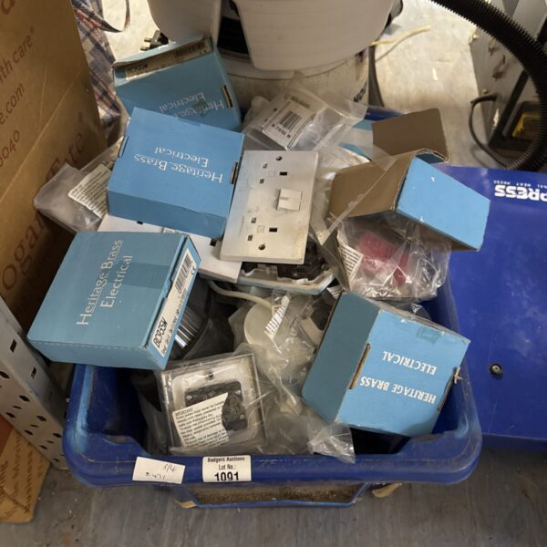 Box of assorted electrical fittings and plug sockets.