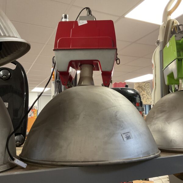 Vintage industrial street lamp with large metal shade.