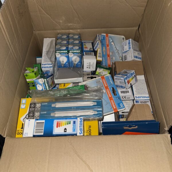 Assorted light bulbs from Philips, Osram, and Sylvania in a cardboard box.