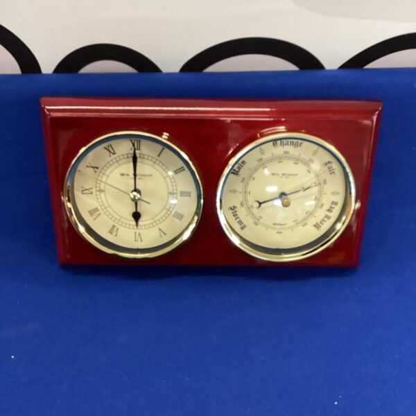 Vintage Wm Widdop clock and barometer in wooden case.