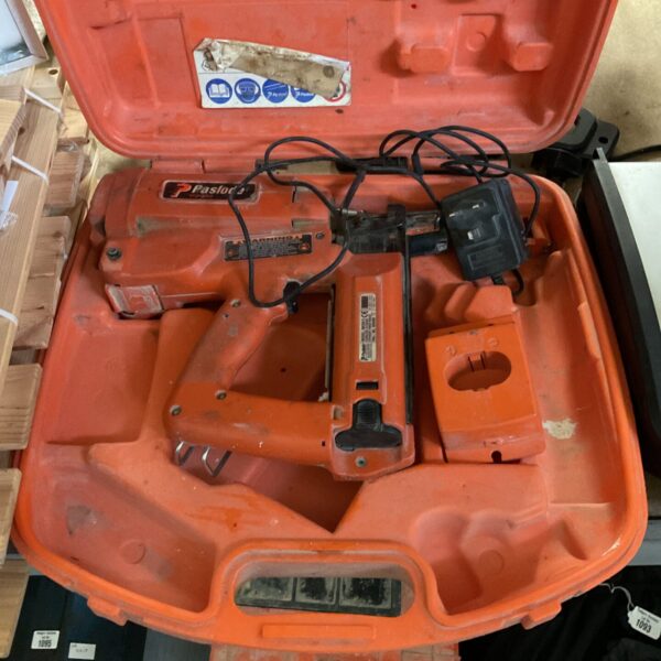Orange Paslode Impulse nail gun in open carrying case.
