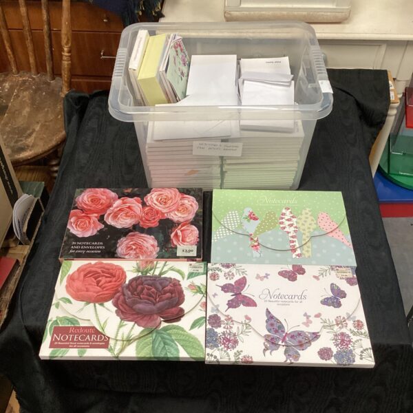 Mixed lot of occasional notecards and blank notepads for writing.