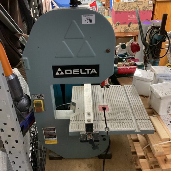 Vintage Delta band saw for woodworking and metal cutting.