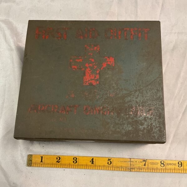Vintage first aid outfit for aircraft dinghy, showing wear and age.