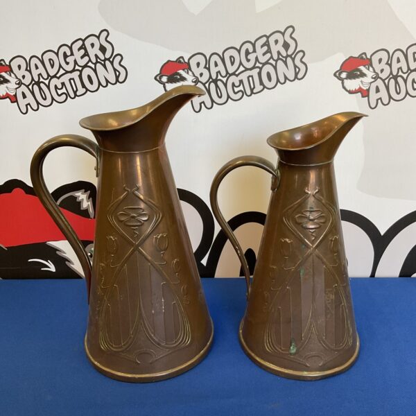 Pair of joseph sankey & son art nouveau copper pitchers