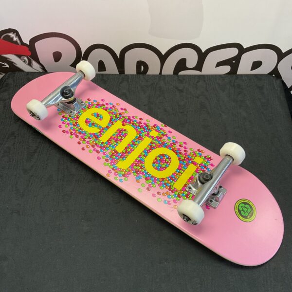 New pink enjoi skateboard with tensor trucks for street skating.