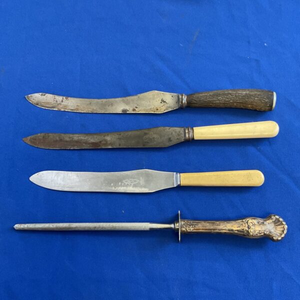 Vintage carving knives and sharpening steel set, antique kitchen tools.