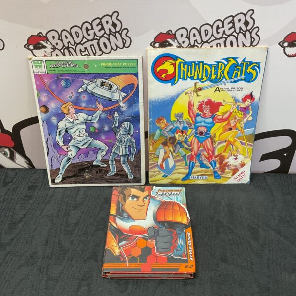 Vintage Thundercats book, Buck Rogers puzzle, and Action Man guide lot.