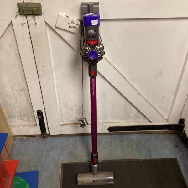 Purple Dyson V7 Motorhead cordless vacuum cleaner for parts.