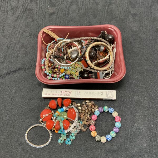 Colourful costume jewellery lot with necklaces and beads.
