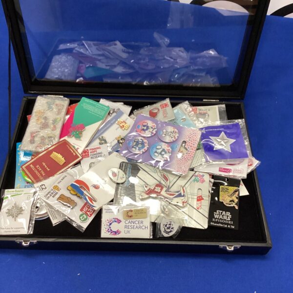 Close-up of a Star Wars badges collection, featuring character pins.
